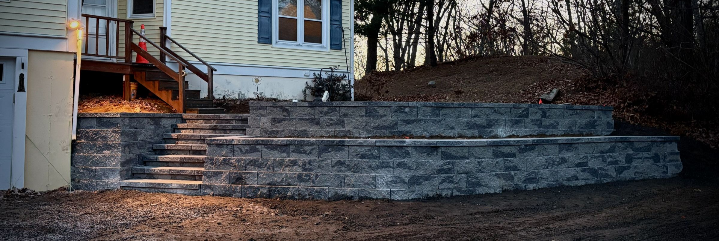 Panoramic view of retaining wall and stone steps by MAC Excavation & Landscape in South Shore MA