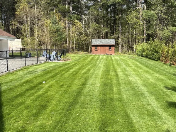 Beautifully striped freshly installed lawn by MAC Excavation & Landscape in South Shore MA