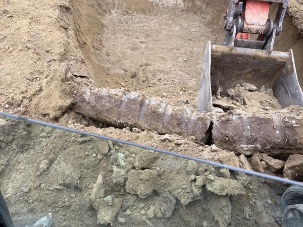 Property digging and excavation with equipment by MAC Excavation & Landscape in South Shore MA