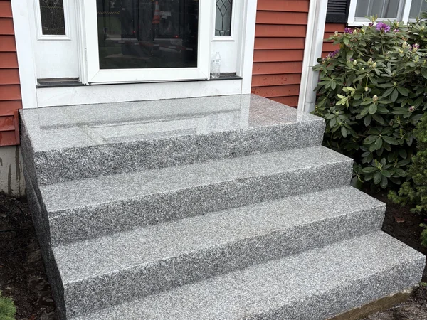 Professional stone front installation by MAC Excavation & Landscape in South Shore MA