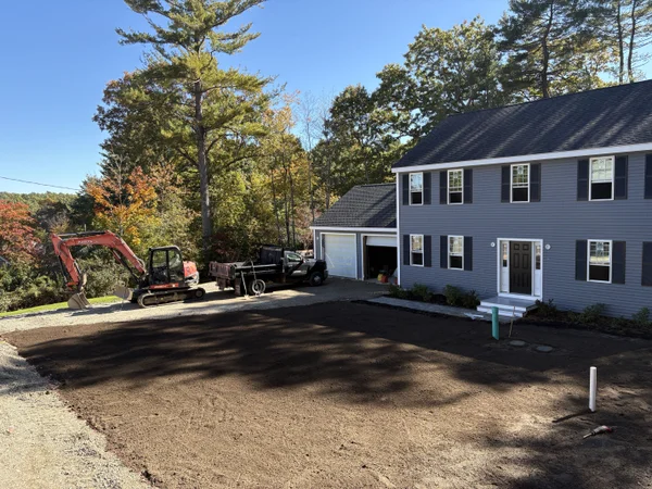 Professional lawn installation and yard grading with excavation equipment by MAC Excavation & Landscape in South Shore MA