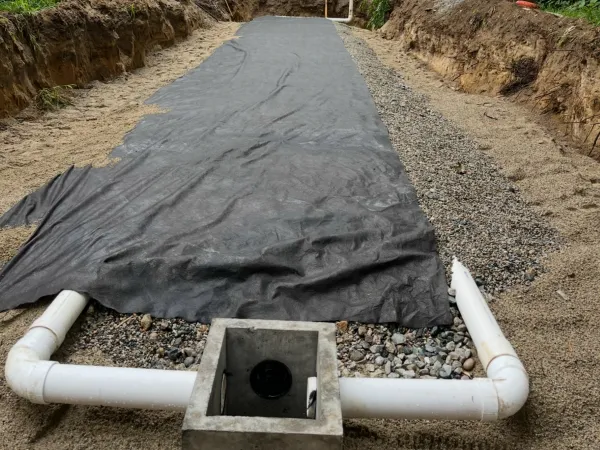 Septic system excavation showing deep trench work by MAC Excavation & Landscape in South Shore MA